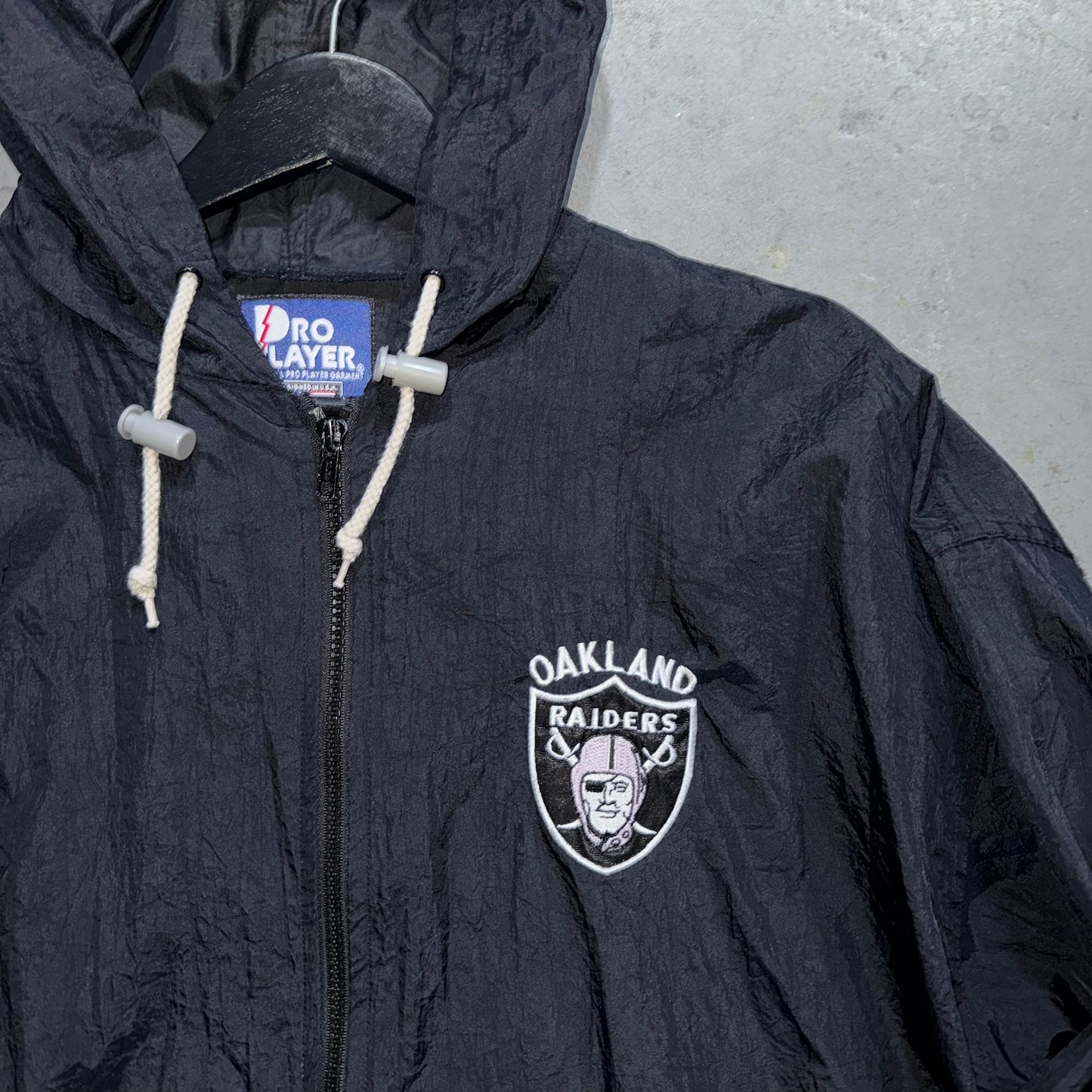 Vintage Oakland Raiders Pro Player Full Zip Windbreaker. Size Large